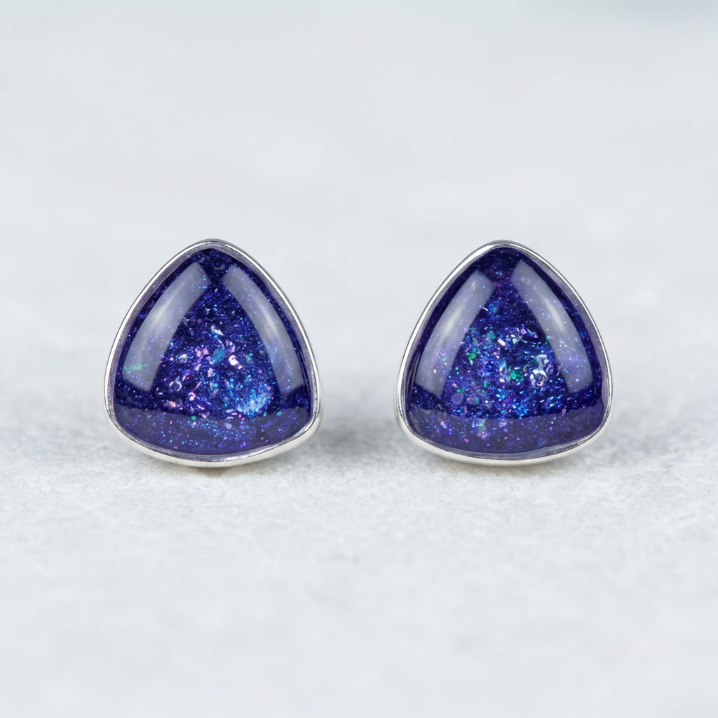 Triangle stud earrings on white stone