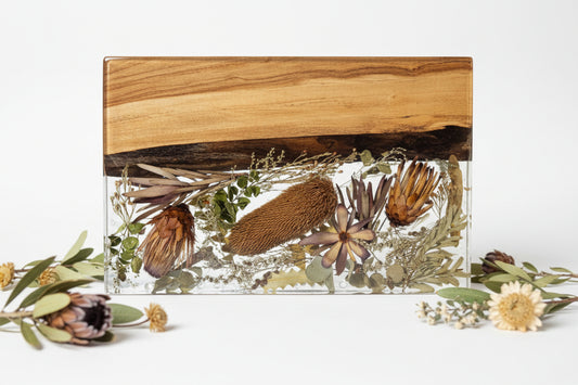 “Rectangular timber and clear resin memorial piece with preserved native flowers and botanicals