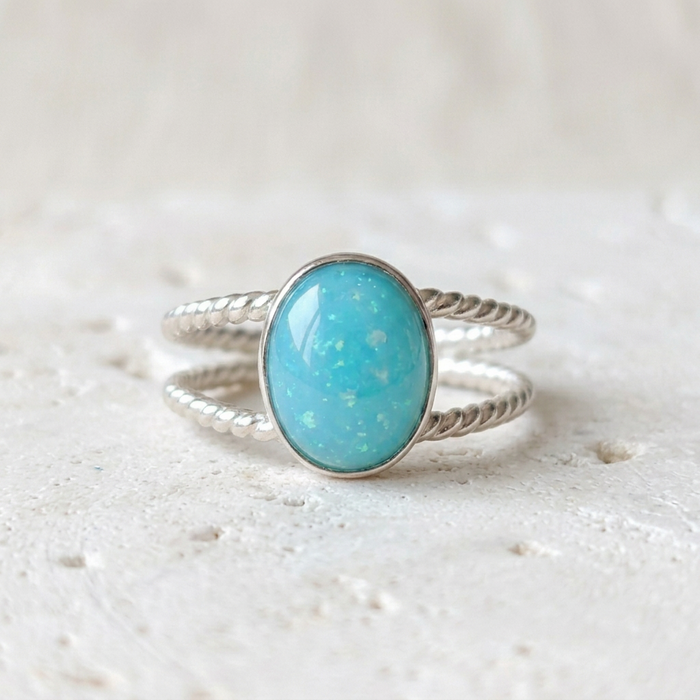 Double Twist Oval Ring on soft oatmeal linen