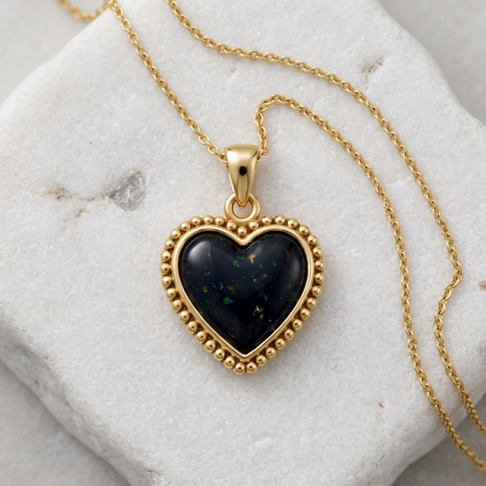 Gold-plated Beaded Heart Pendant in Black Opal on a soft white background