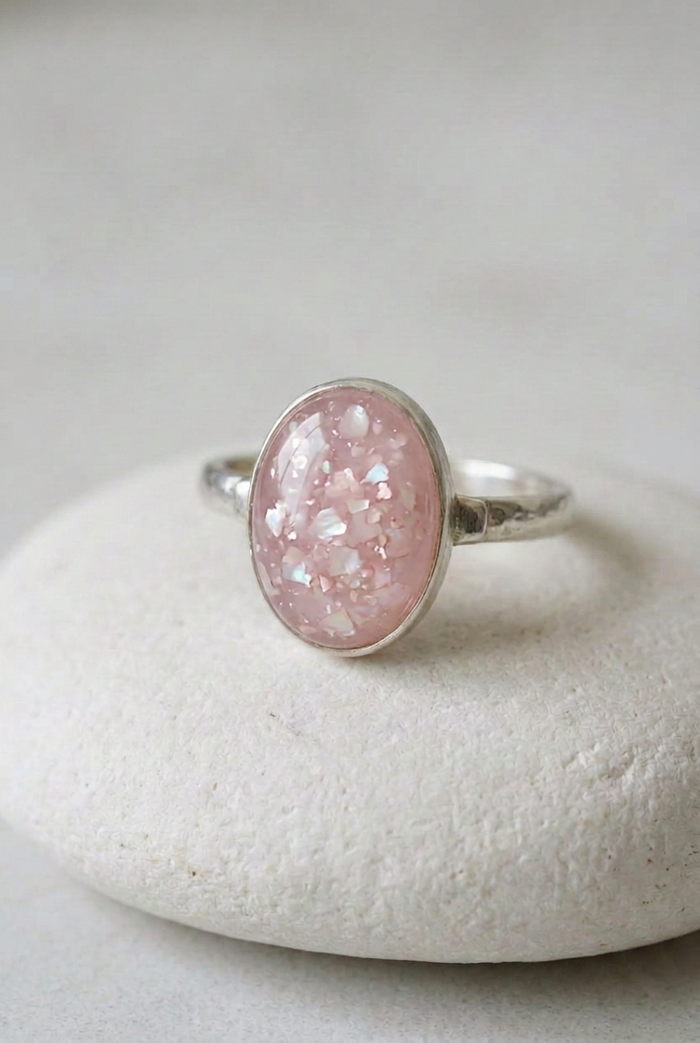 Stella Oval memorial ring on matte white stone