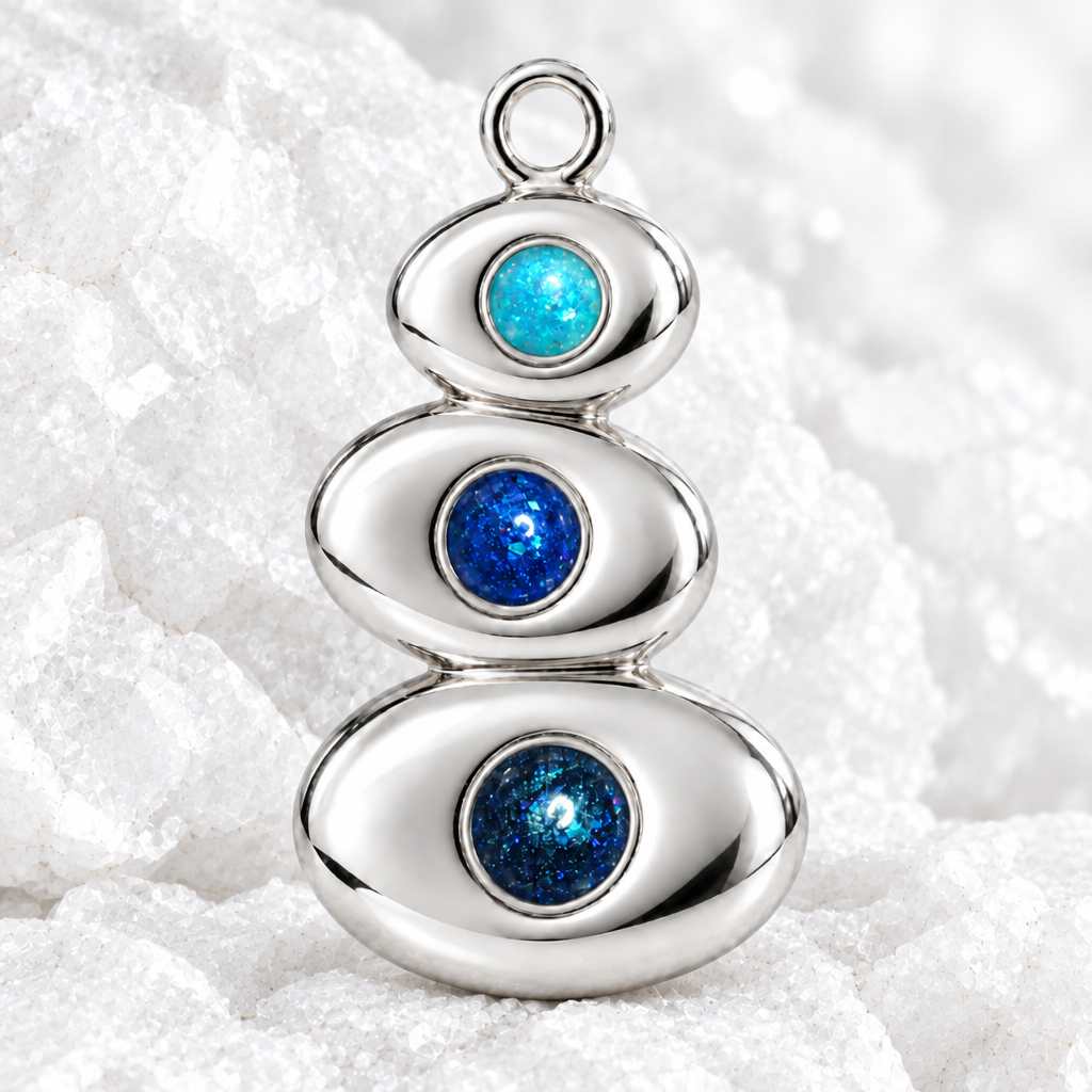 The Cairn pendant on white textured rock